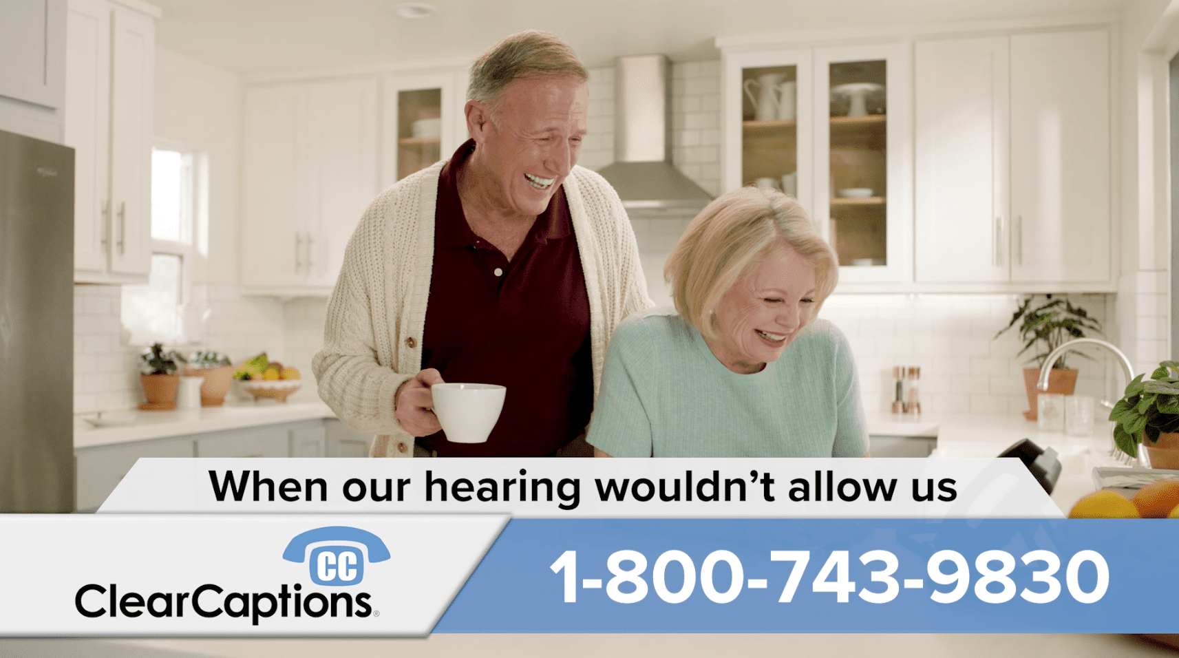 Retired couple in their kitchen talking on clearcaptions phone. Play Clear Captions commercial.