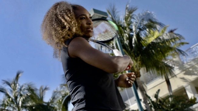 Serena Williams swinging tennis racket
