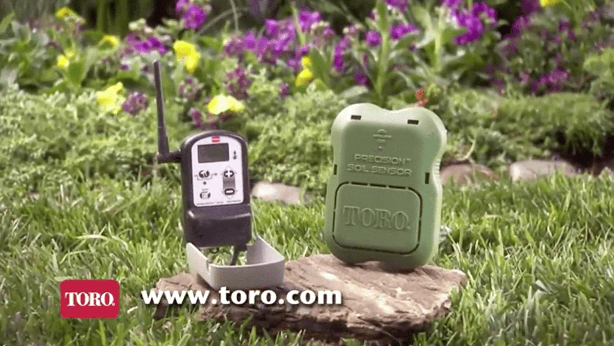 Toro Water sensor on rock in the grass.