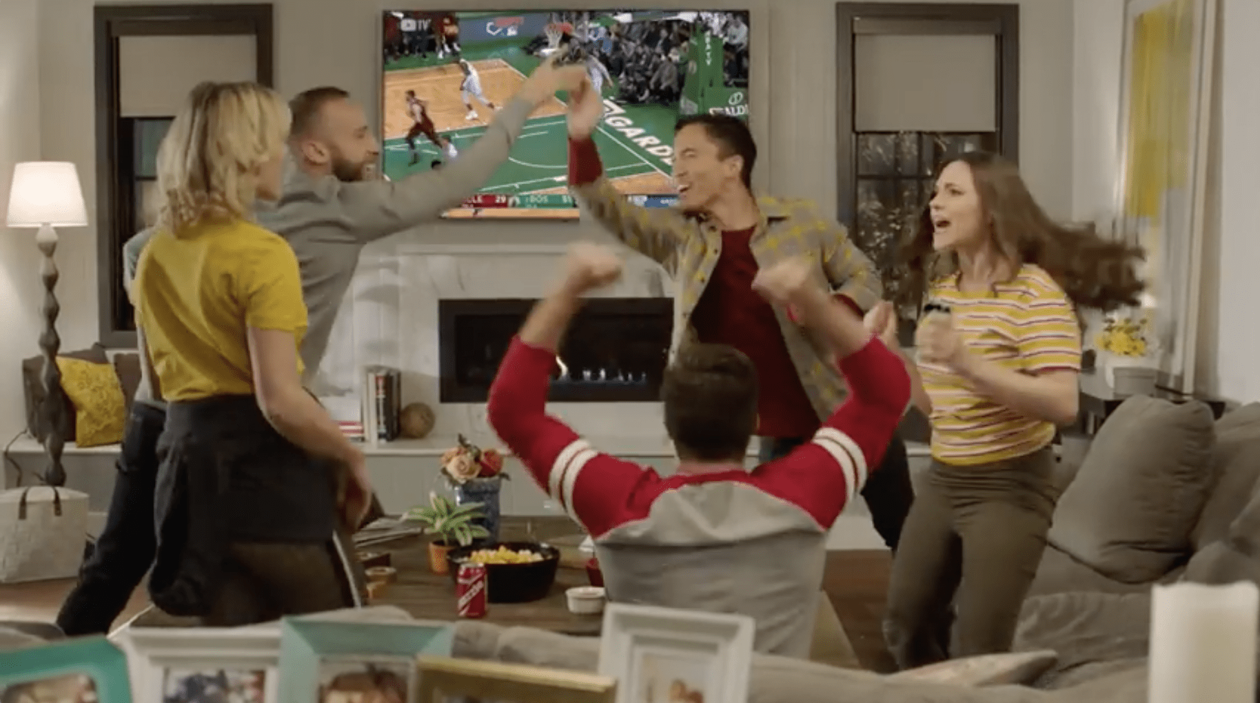 group celebrates after basketball score in YouTube commercial